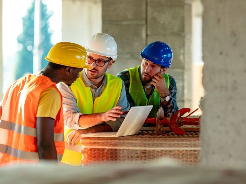 Construction managers reviewing project progress Construction managers reviewing project progress