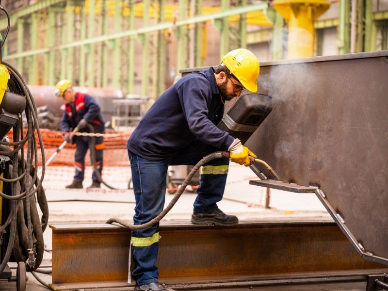 Construction worker performing concrete installation