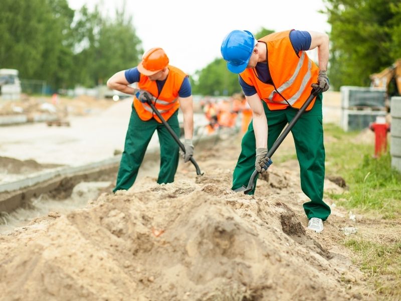 Construction workers reviewing safety guidelines on-site