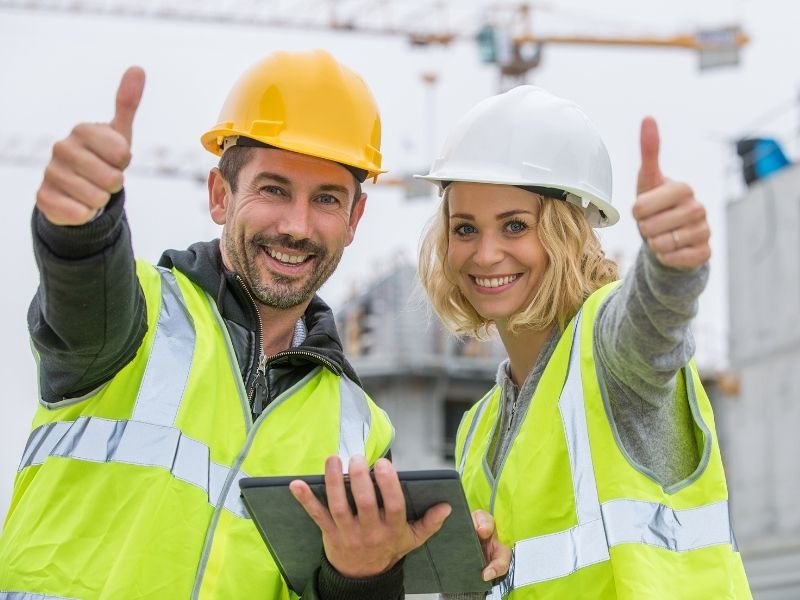 Contractors discussing project plans outdoors