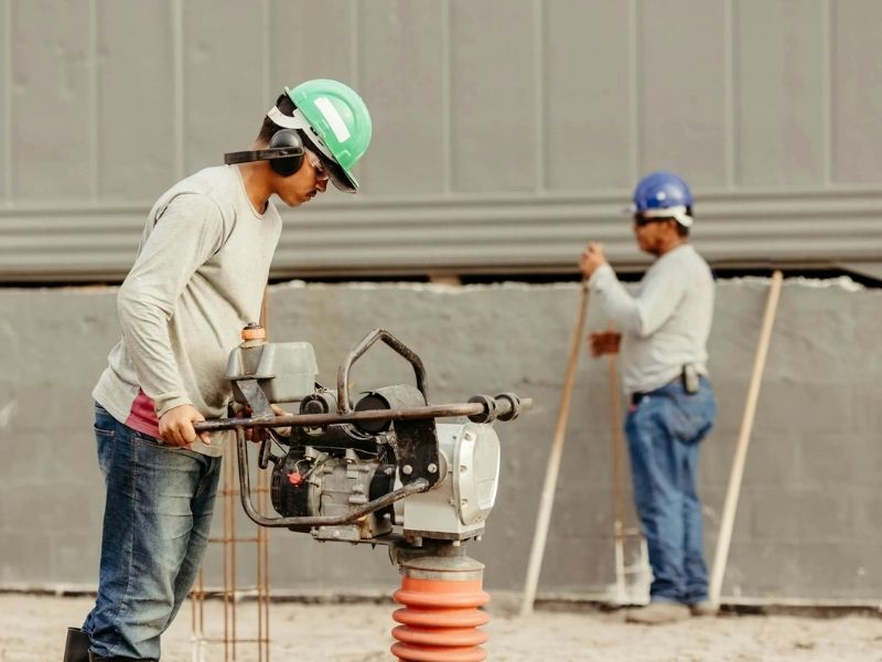 Contractors inspecting job site for risk management
