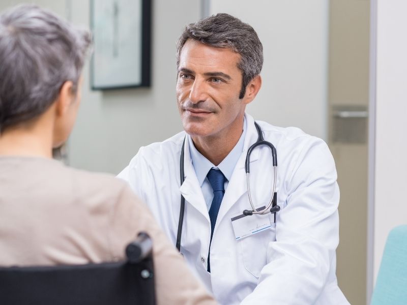 Doctor conducting consultation with patient
