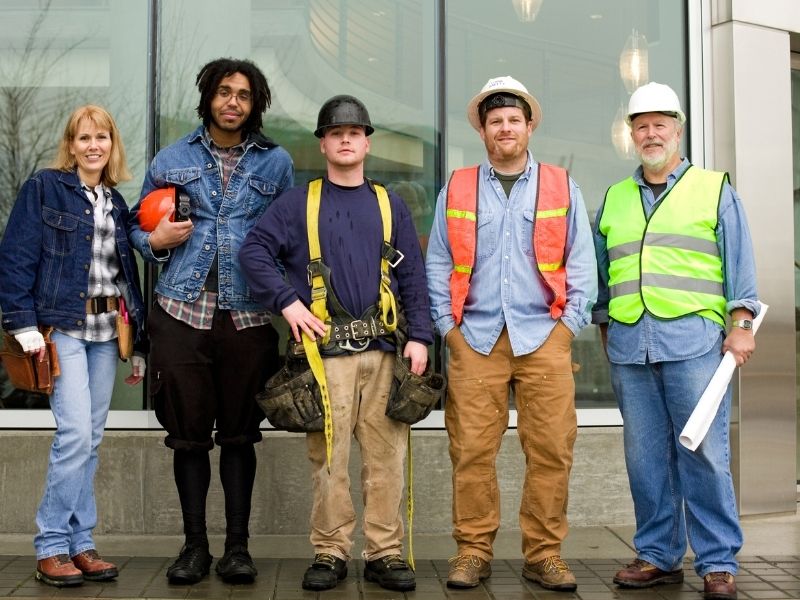 Skilled trades team posing at a job site