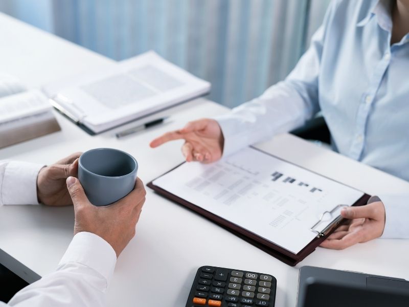 Business owner reviewing liability protection and risk exposure with umbrella insurance