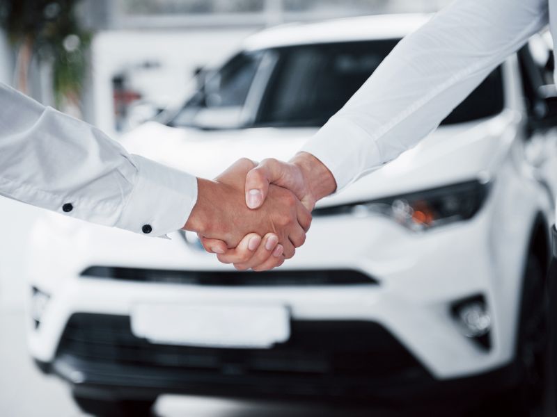 Florida business owner inspecting a company vehicle with commercial auto insurance coverage