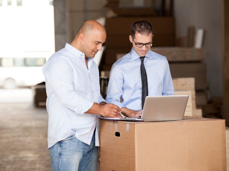 Office team reviewing information with systems secured by cyber insurance