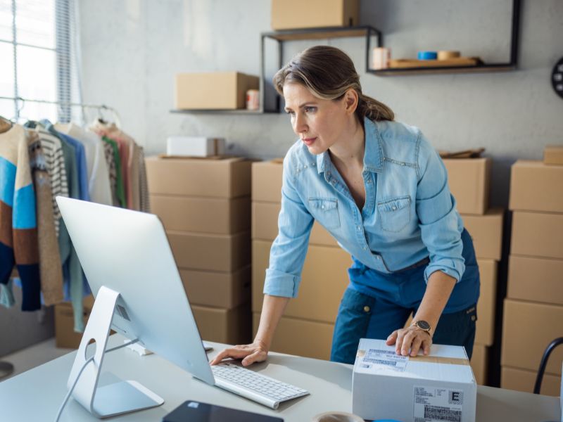 Professional working on a laptop with company data protected by cyber insurance