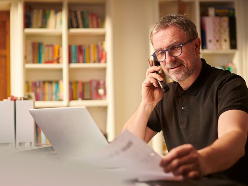 Small business owner managing digital operations with cyber liability coverage