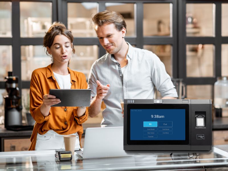 Small business owners using ClearPalm’s time clock device to track employee hours at their Florida coffee shop. Proximity Card Time Clock